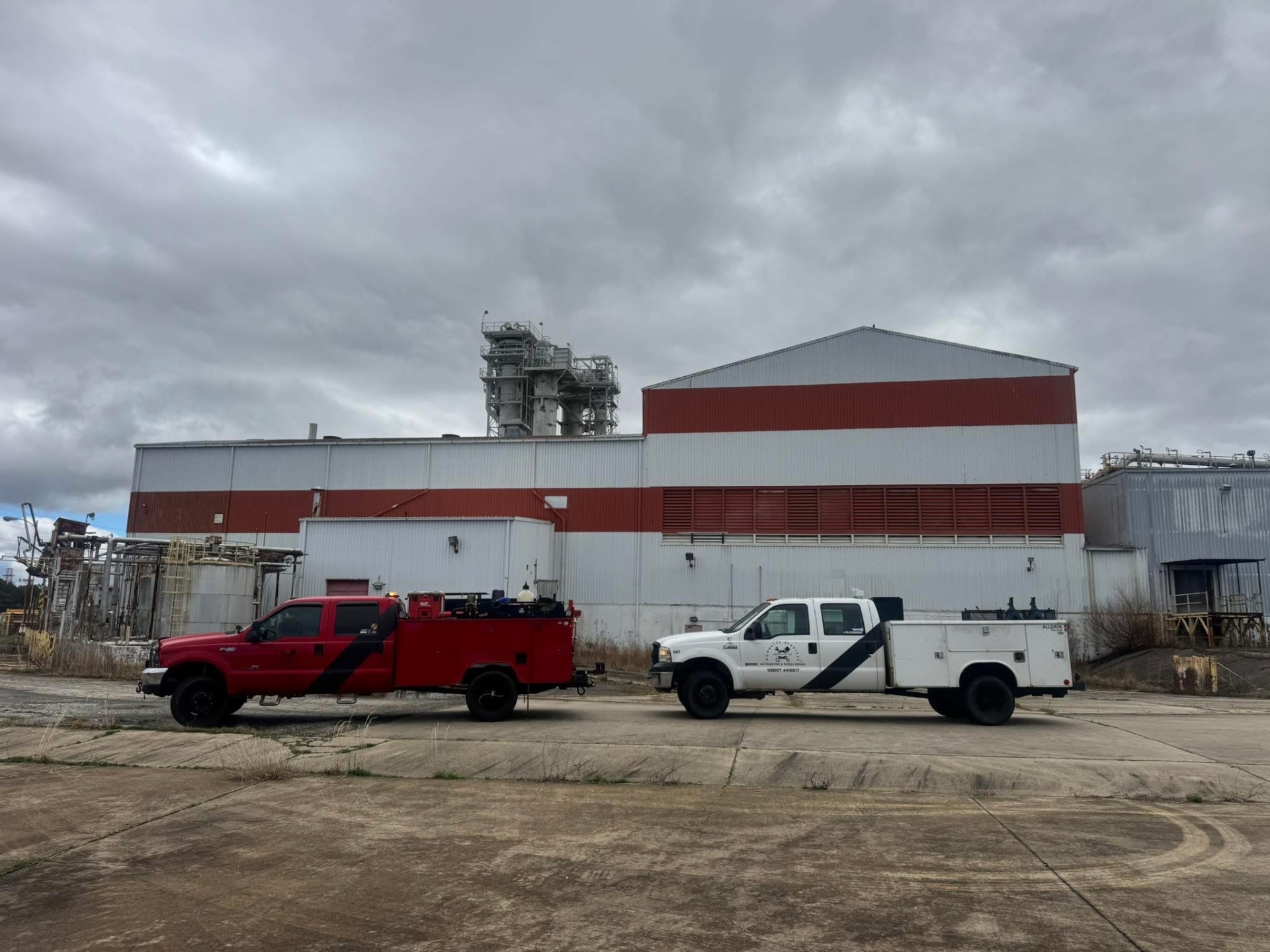 Gunnells mobile service trucks parked on-site at an industrial facility